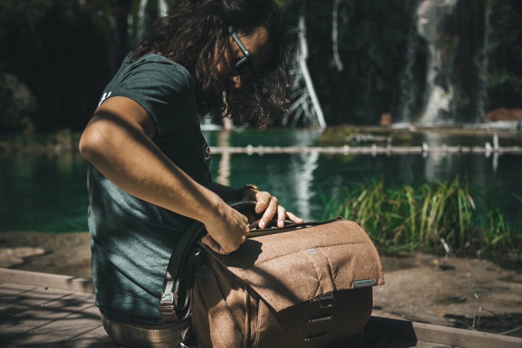 Man looking in his bag near Hanging Lake, Colorado