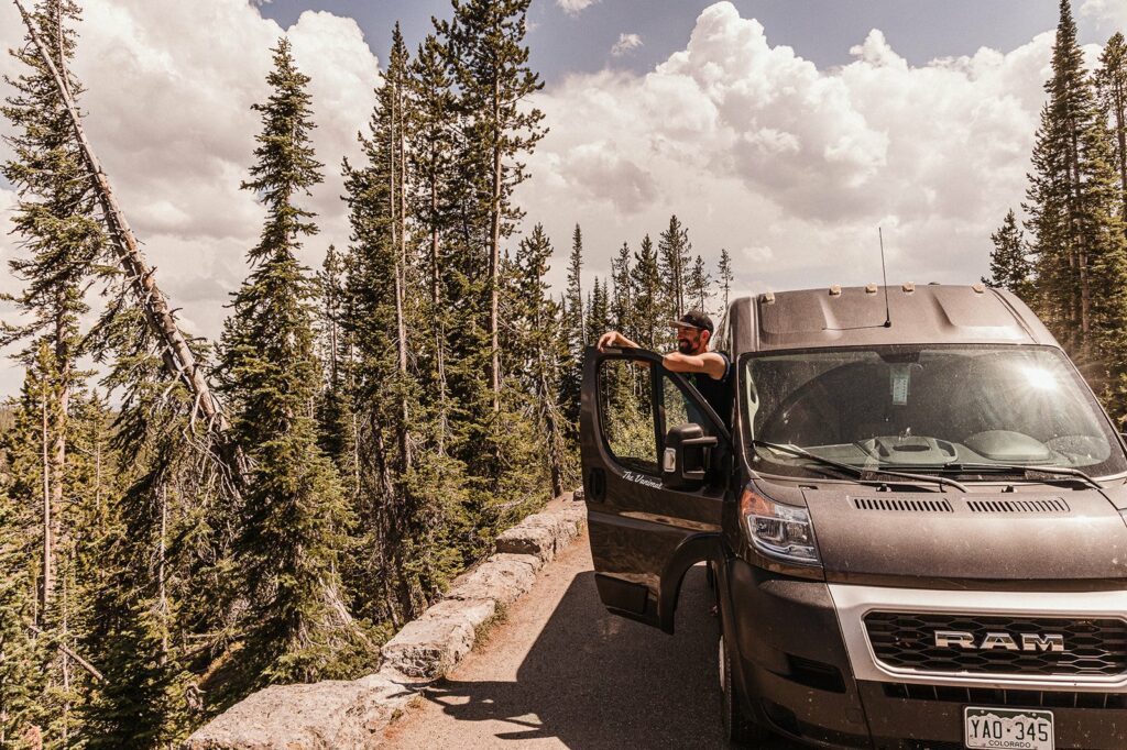 Man looking out after pulling off to the side of the road