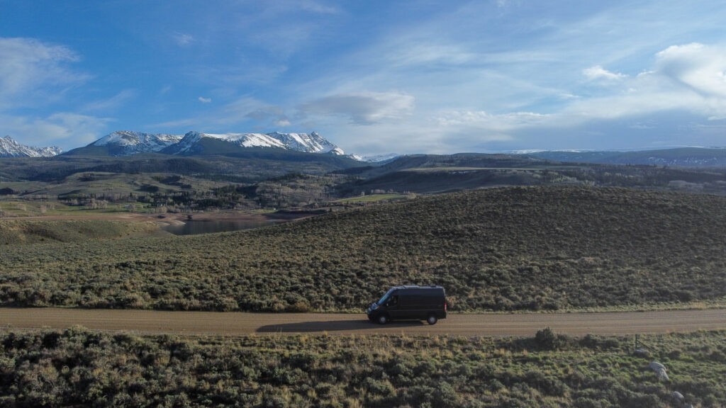 Campervan driving on a dirt road in Rocky Mountain National Park