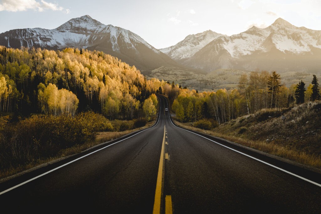 Beautiful pictures of a fall road amongst Aspen trees and mountains in Colorado