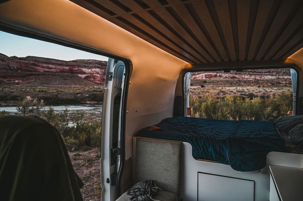 Inside of a campervan with views of a river