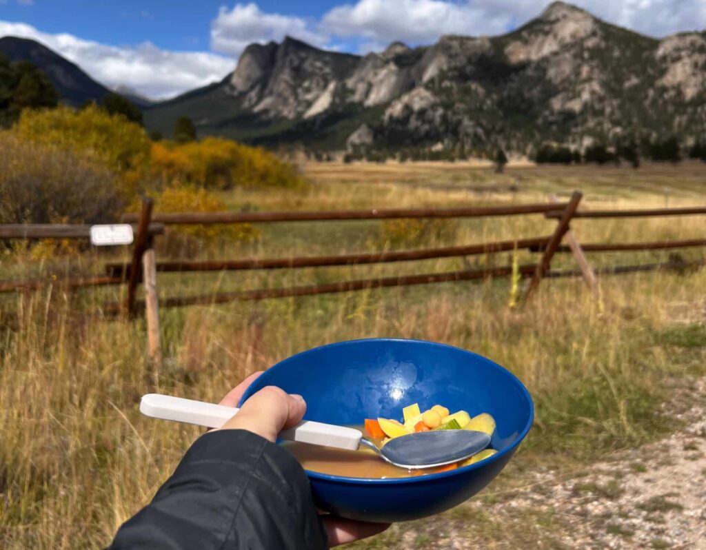 Bowl of soup with mountains in the background