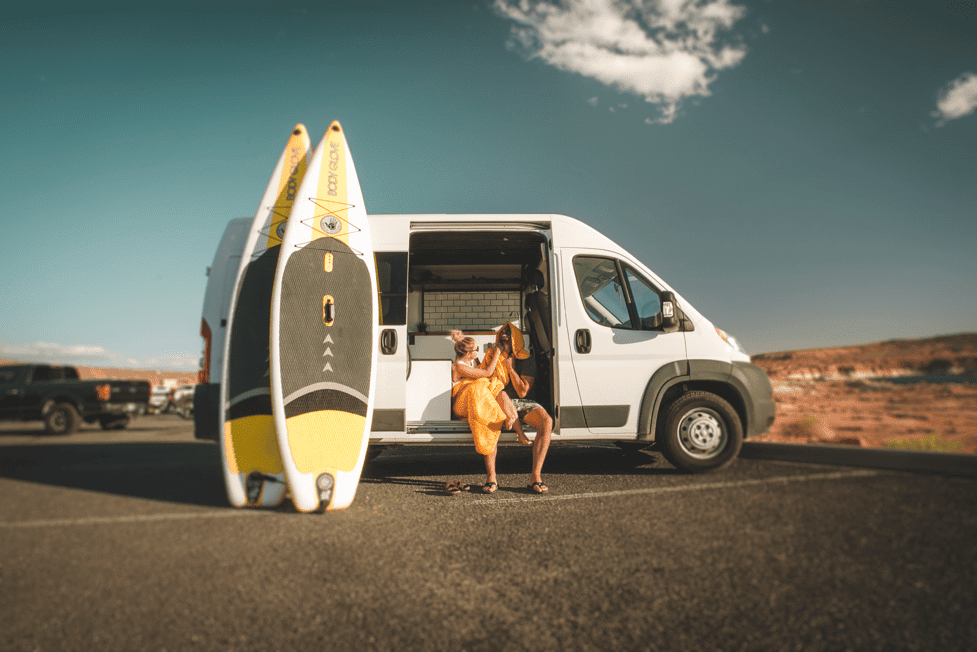 A couple with Stand Up Paddleboards