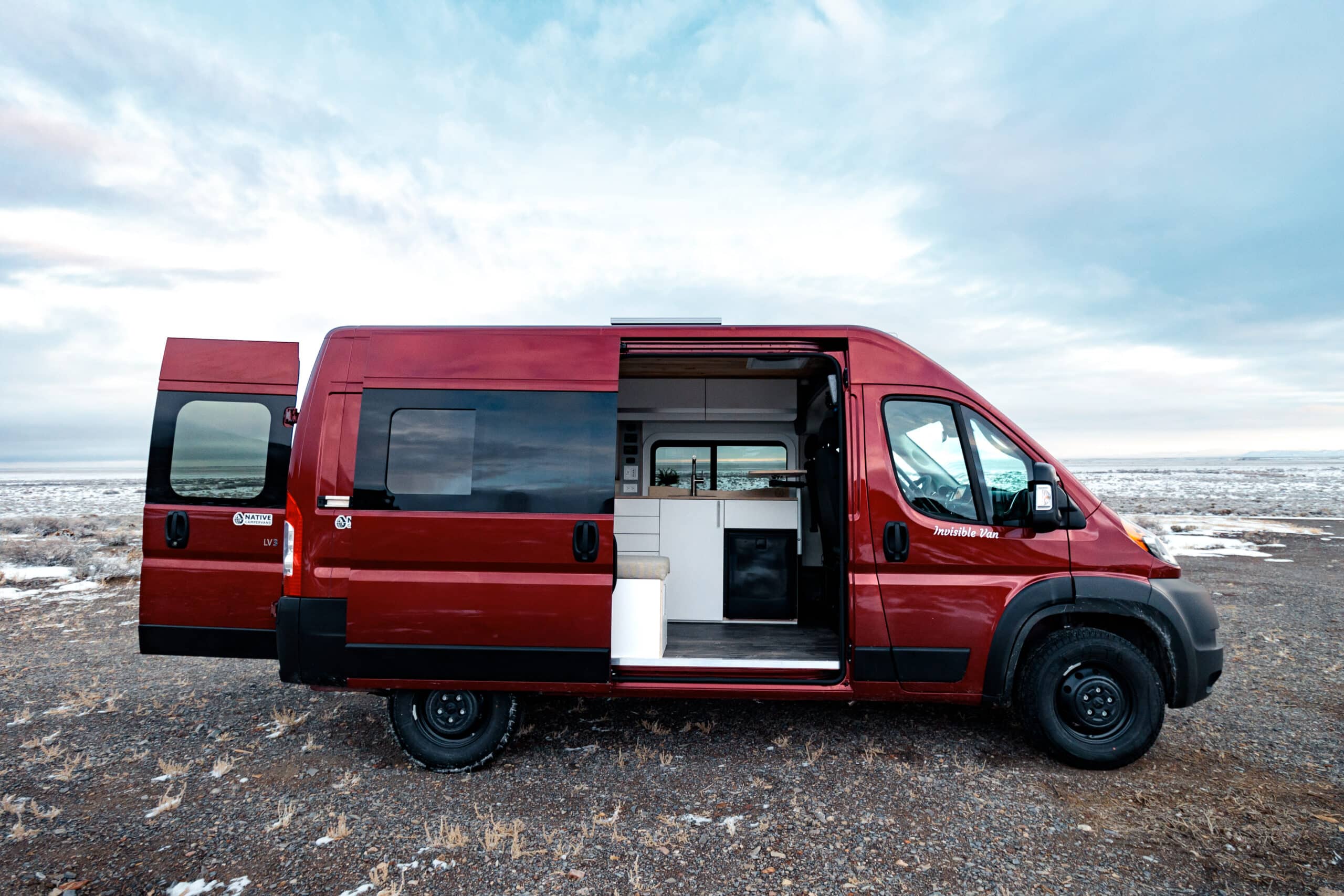 A Red Biggie Campervan by Native Campervans in the Snow
